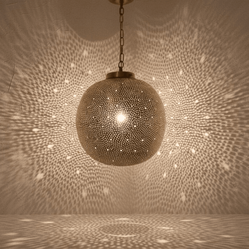 Gift Guide Brass and Copper Pieces for a New Home featuring Brass Globe Pendant Light
