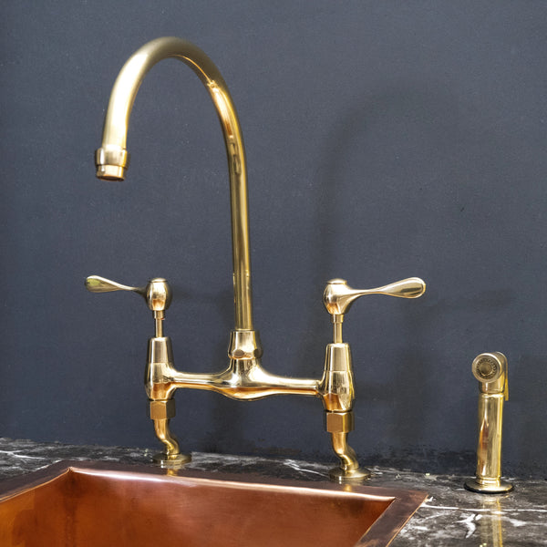 AquaPrime unlacquered brass curved legs bridge kitchen faucet – front view