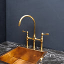 Unlacquered brass 3-hole bridge faucet – top-down installation view