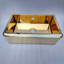 Unlacquered brass farmhouse sink – side view showing apron front design