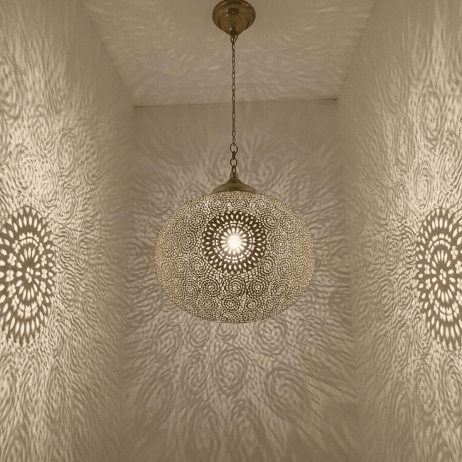 Moroccan brass boho pendant light casting intricate shadow patterns on wall – Brass For Homes