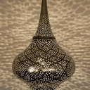 Brass pierced pendant light with artistic shadow patterns in boho interior – Brass For Homes
