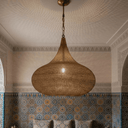 Perforated brass onion dome light – hanging in entryway