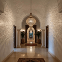 Tall brass teardrop pendant lamp casting decorative shadow patterns – Brass For Homes
