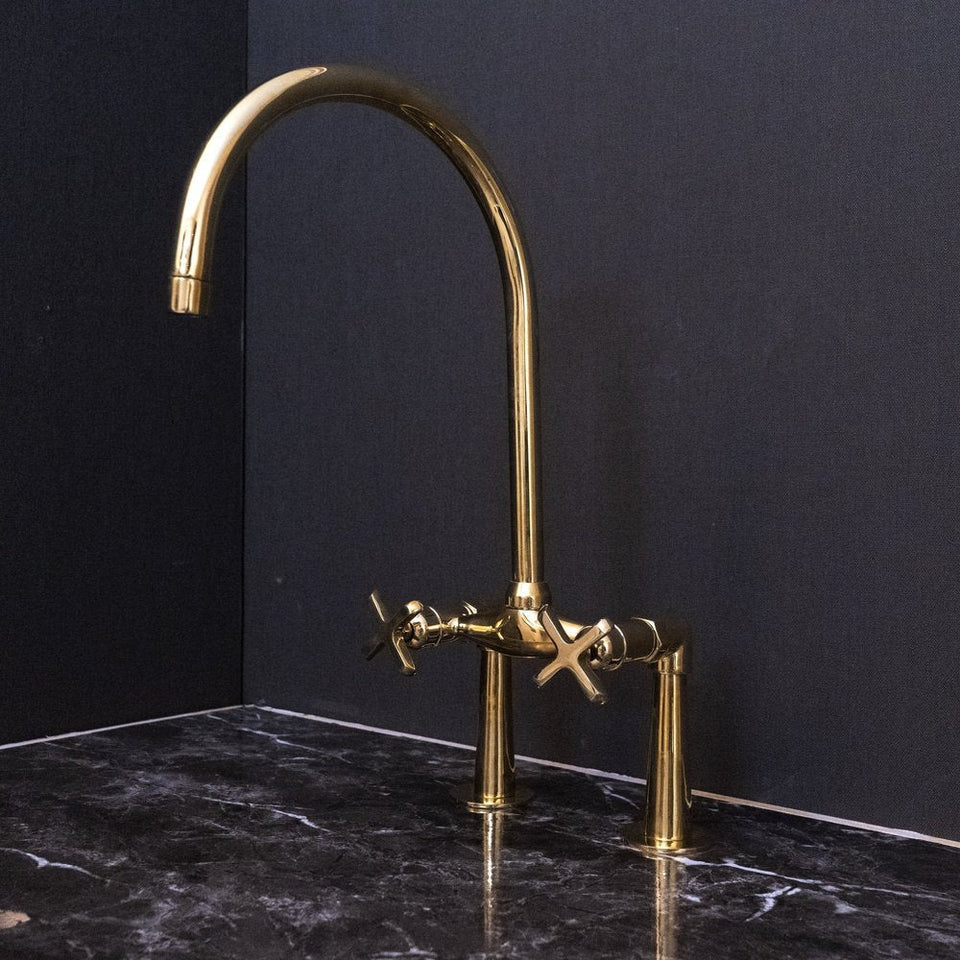 Unlacquered brass bridge faucet with curved legs and cross handles – front view