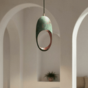 Verdigris copper cutout dome pendant emitting warm patterned shadow light — Brass For Homes