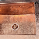 Hammered copper undermount sink – warm copper tones, side view