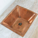 Handcrafted hammered copper sink – top-down view showing bowl